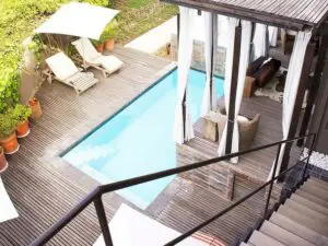 Cape Town's hot summer afternoons are best spent next to the pool on a comfortable lounger.
