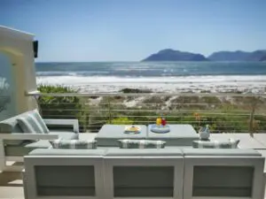 Enjoy a refreshing beverage on the wooden deck as you look out over spectacular ocean and mountain views.