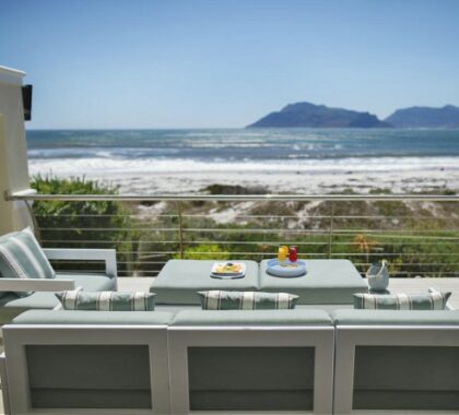 Enjoy a refreshing beverage on the wooden deck as you look out over spectacular ocean and mountain views.