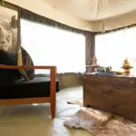 Pick a quiet nook in your private tent to enjoy a peaceful drink, and jot down the day's animal encounters.
