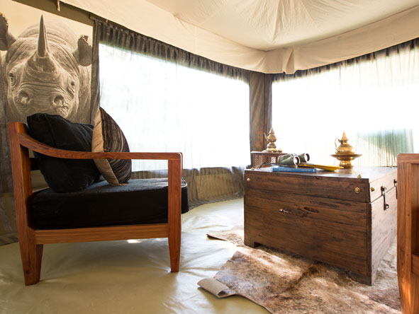 Pick a quiet nook in your private tent to enjoy a peaceful drink, and jot down the day's animal encounters.
