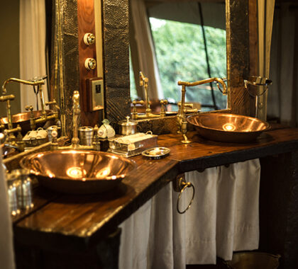 A burnished copper basin and bathtub with a free-fall rain shower is just one of the reasons it'll be hard to leave your suite!