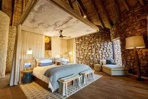 Luxury accommodation in authentic stone-walled and thatched-roofed bungalows.