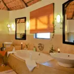 Each room has an en suite bathroom with bath as well as indoor & outdoor showers.
