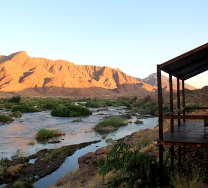 Set on the Kunene River, Okahirongo Camp affords access to one of Southern Africa's most remote environments.