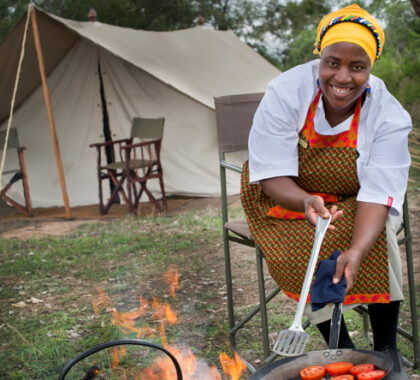A meal cooked over the coals is part of the field camping experience at Tanda Tula.