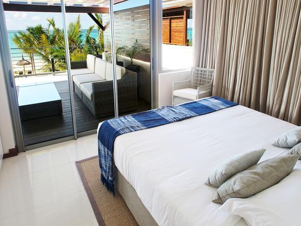 The bedroom opens up onto a private deck.
