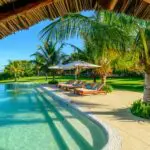 Spend the day lazing at the poolside listening to the gentle breeze through the palm trees.

