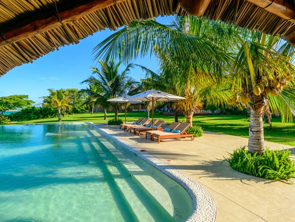 Spend the day lazing at the poolside listening to the gentle breeze through the palm trees.
