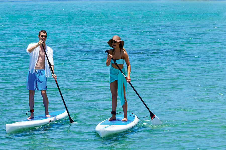 Stand up paddle boarding on the calm Indian Ocean waters.