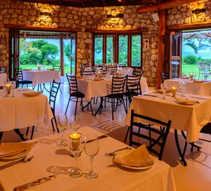 The stone and thatch restaurant has indoor and outdoor seating.
