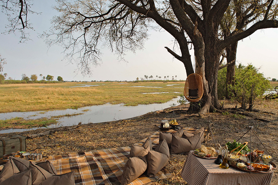 Relaxing by the waterways is a stunning experience coupled by Sandibe Okavango Safari Lodge's alfresco banquet of pan-African cuisine.