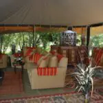 In the comfortable tented living area, you can relax with a good book, grab a drink with friends, or sit back and enjoy the views.
