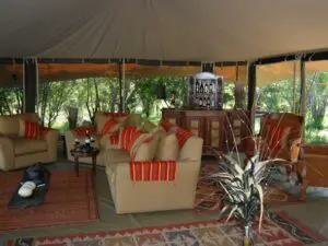 In the comfortable tented living area, you can relax with a good book, grab a drink with friends, or sit back and enjoy the views.
