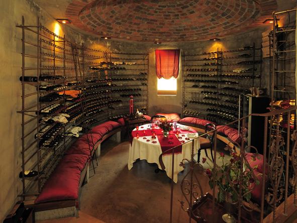 Enjoy an intimate dinner in the romantic wine cellar.