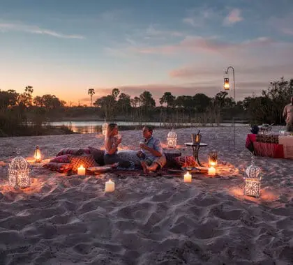 tongabezi_lodge_sandbar_couple_1