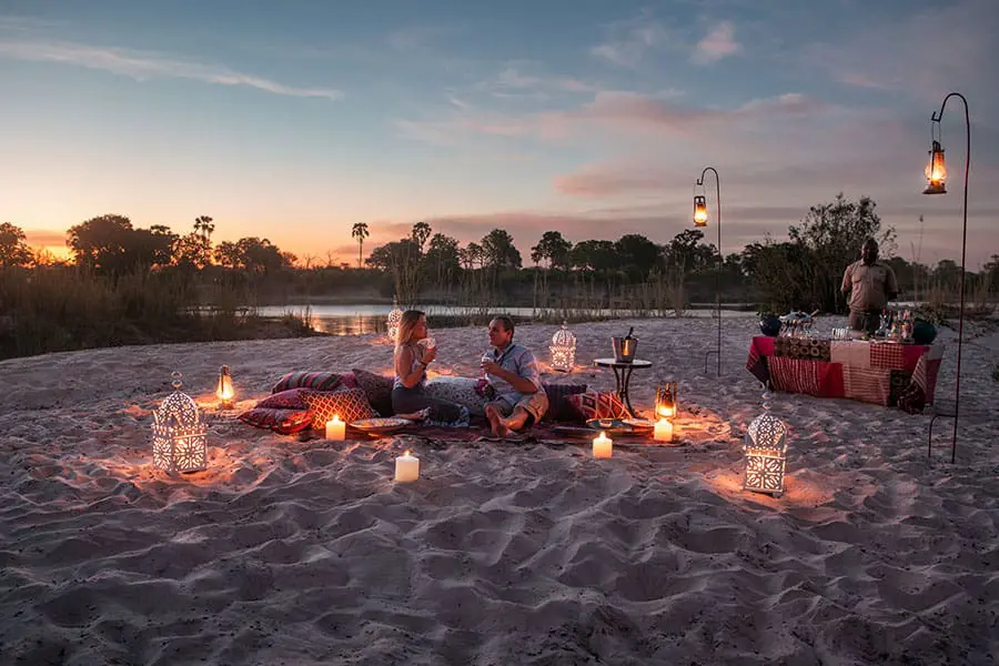 tongabezi_lodge_sandbar_couple_1