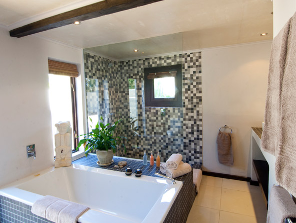 Relax and unwind in your private bathroom equipped with a separate bathtub and a shower.
