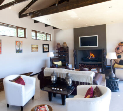 The living area is cosy space to unwind with loved ones, or snuggle up to the fire in during winter months.
