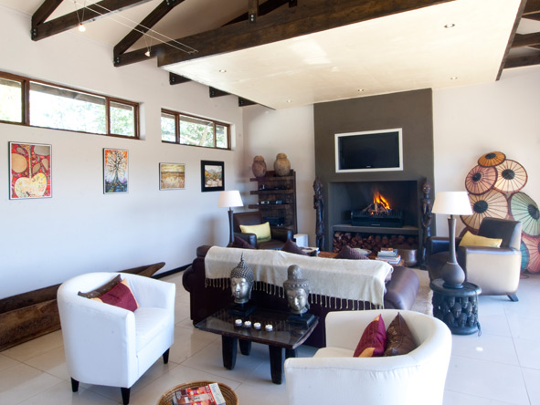 The living area is cosy space to unwind with loved ones, or snuggle up to the fire in during winter months.
