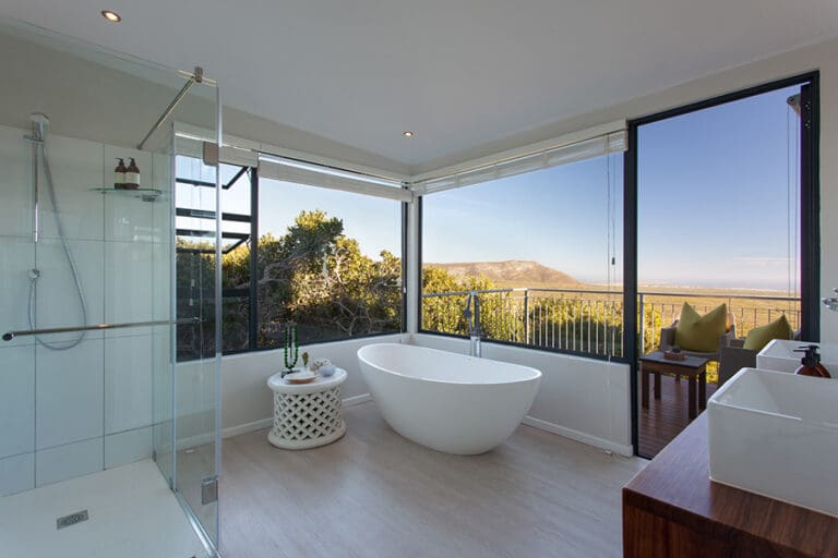 Stylish bathrooms with stunning views at Garden Lodge.
