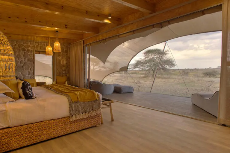wetu_-_namiri_plains_-_tent_interior_looking_out_onto_the_plains