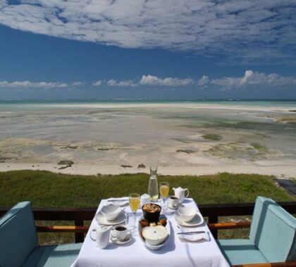 Enjoy your meals on the deck overlooking the beautiful beach.