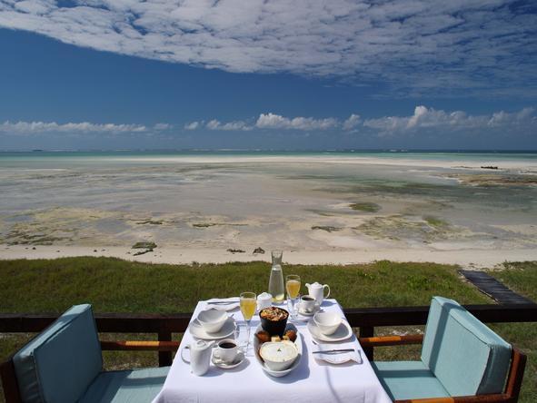 Enjoy your meals on the deck overlooking the beautiful beach.