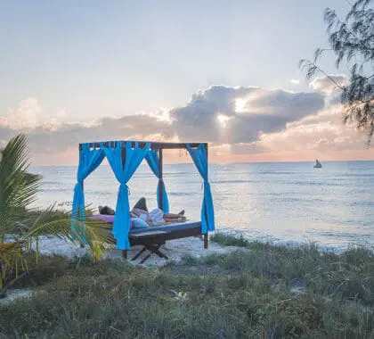 Watch the sun set from the comfort of a beach sala. 