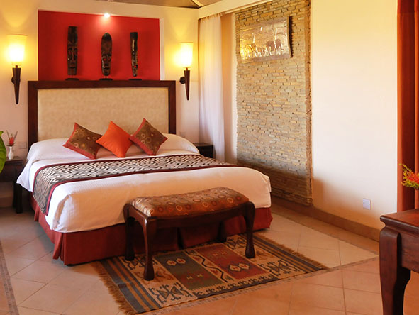 The comfortable chalet-style rooms are equipped with fans, safes and tea and coffee-making facilities.