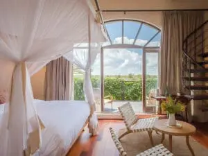 The lucent Tower Room has some of the best views of Nairobi National Park and the Ngong Hills.