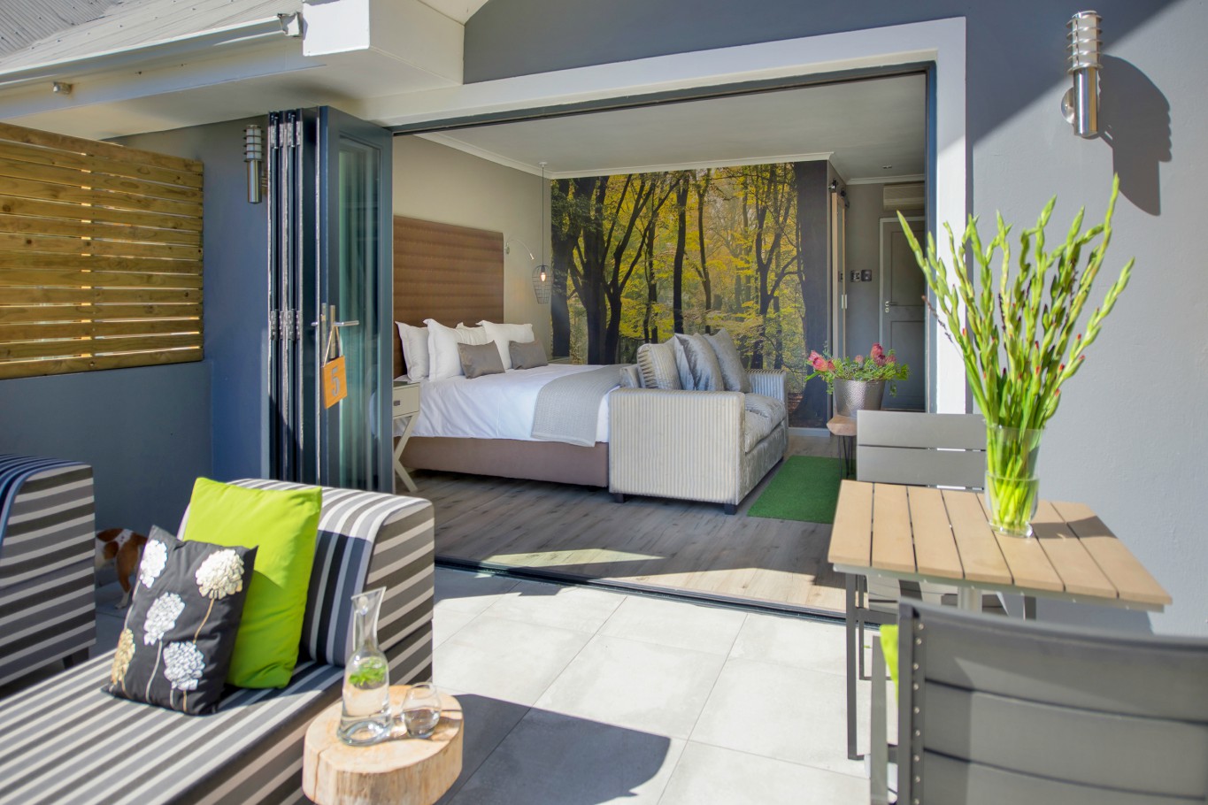 The luxury garden suite has large folding doors that lead to a charming private patio.