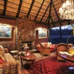 The exquisite décor, thatch roof and chandelier in the main lounge strike the perfect balance between African bush and luxury.