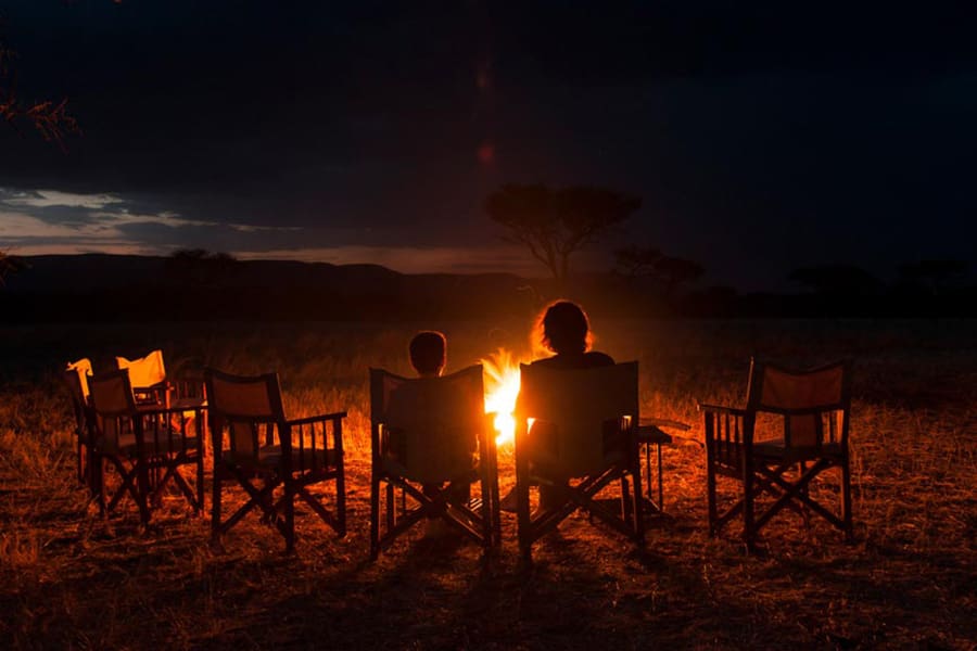 Enjoy a camp fire at Serengeti Kati Kati Camp.