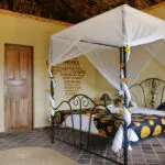 The cottages are large and light-filled, thatched in banana leaves and feature double or twin beds swathed in white netting.  
