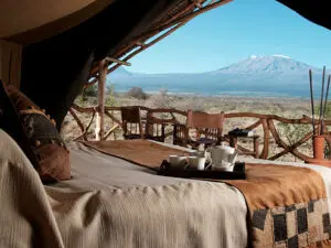 Wake up every morning under the watchful eyes of Africa’s magnificent Kilimanjaro.