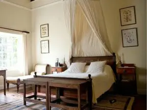 Rooms are spacious and well proportioned, featuring wooden furniture and soft rugs.