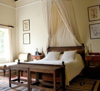 Rooms are spacious and well proportioned, featuring wooden furniture and soft rugs.