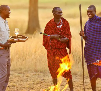 Enjoy sundowners with a the local Masaai warriors. 