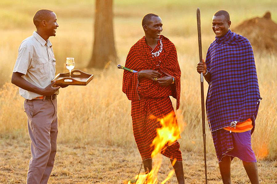 Enjoy sundowners with a the local Masaai warriors. 