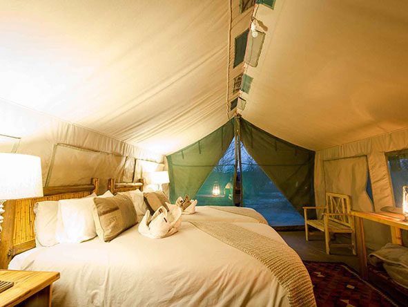 Sleep peacefully in your canvas tent at Tuskers, with soft sheets and warm lighting to keep you comfy. 