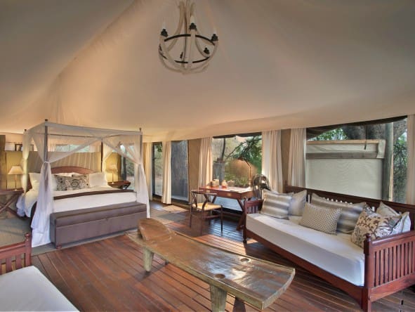 Your large canvas tent at Kanga Camp has a lounge area and en-suite bathroom.