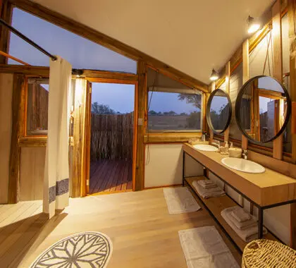 Bathrooms are equipped with flush toilets, double vanities and showers.