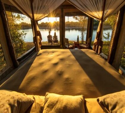 En-suite safari tents are spectacularly located on the banks of the Luangwa River, overlooking the resident hippo pool.