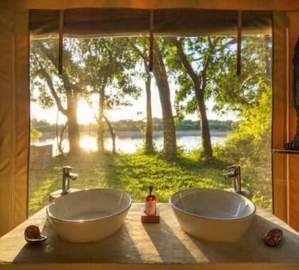 Double vanities face the remarkable Luangwa River.