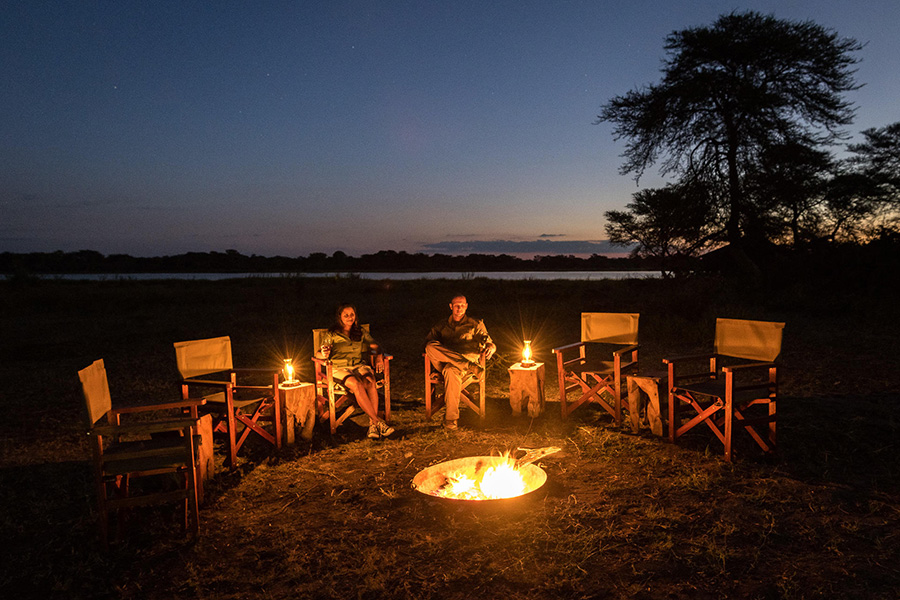Spend lantern-lit evenings around the camps pit fire.