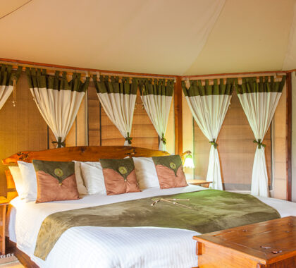 Luxury bedroom at Tipilikwani Mara Camp.