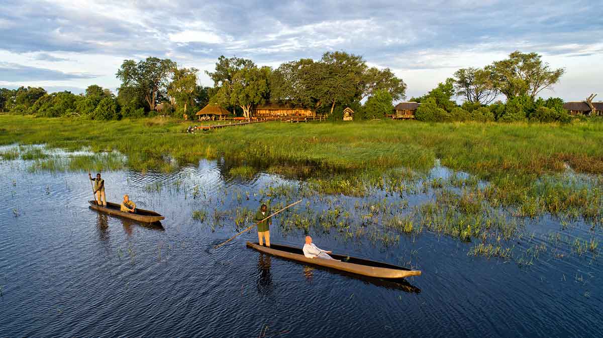 Go2African travellers on mokoros near Mapula Lodge in the Okavango Delta, Botswana