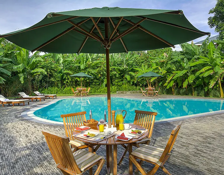 Enjoy a leisurely breakfast by the pool at Bishops House.