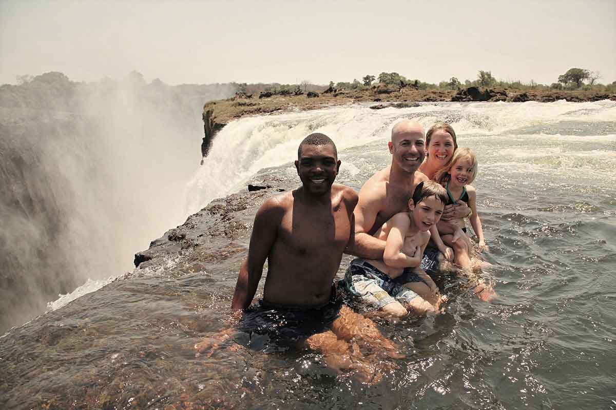 Go2Africa travellers in the Devil's Pool on the edge of Victoria Falls
